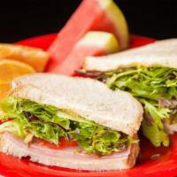 Simply Ham · Sliced baked ham, provolone cheese, mixed greens, tomatoes, pickles and Dijon on your choice...