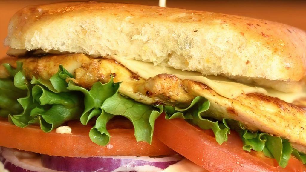 Spicy Chicken · Jalapeno Cheese Bun, Grilled Chicken Breast or Crispy Fried Chicken, Pepper Jack Cheese, Lettuce, Tomatoes, Red Onions & Tabasco Mayo