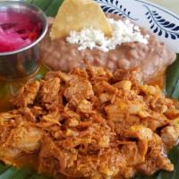 Cochinita Pibil · Shredded pork stew slow marinated and slow cooked with fine spices and condiments like achio...
