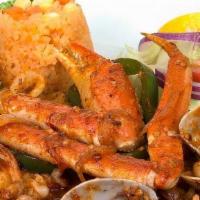 Guiso De Mariscos · Calamari, crabs, clams, octopus, scallops, shrimp and tilapia sautéed in La Marea sauce.