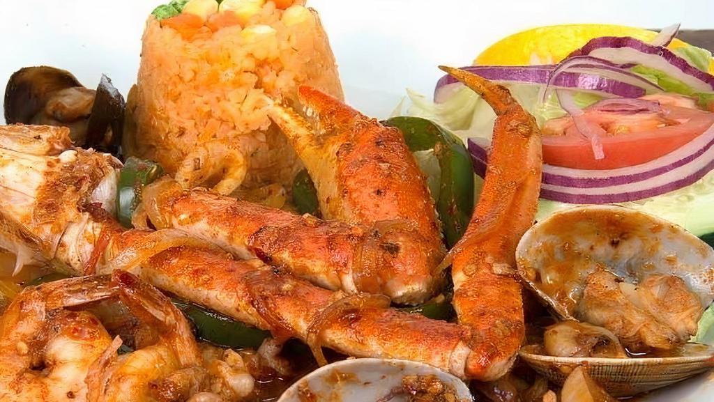 Guiso De Mariscos · Calamari, crabs, clams, octopus, scallops, shrimp and tilapia sautéed in La Marea sauce.