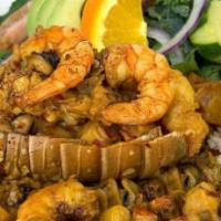 Cola De Langosta Marimar · Lobster tail with a mix of shrimp, octopus, chopped clam, crab. Cooked in our special Nayari...