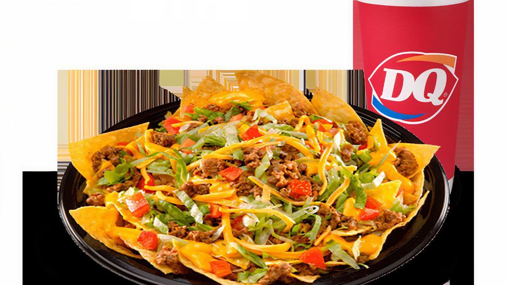 Nacho Deluxe Combo · Large platter of crisp fresh tortilla chips covered with seasoned beef, refried beans, nacho cheese sauce, crisp lettuce, diced ripe tomatoes, and cheddar cheese and served with picante sauce on the side. 740-1220 Cal