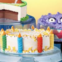 Dq® Celebration Cakes · Irresistible fudge and crunch center surrounded by vanilla and chocolate soft serve, decorat...