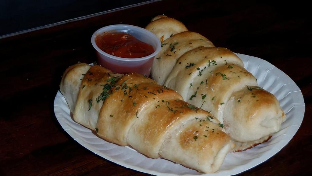 Pizza Joint · Pepperoni and mozzarella rolled into the homemade dough a hint of garlic topped with oregano and parsley. served with a side of parmesan marinara.