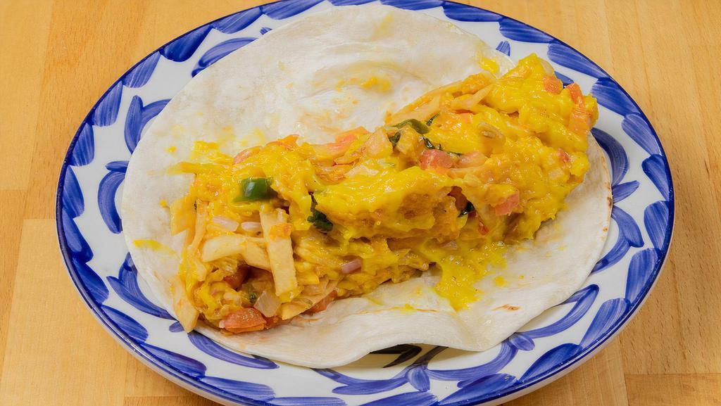 Vigas Taco · Vegan chickpea scramble with pico de gallo and tortilla strips.