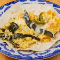 Polanco · Scrambled eggs, roasted corn, poblano peppers, Oaxaca cheese.