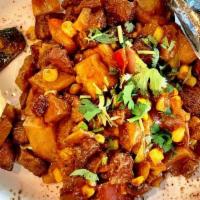 Revuelto Vegano · Vegan hash with sweet potatoes, plantains, potatoes, sweet corn, red bell pepper, red Vidali...