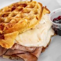 Phat Boy Sandwich · Ham, cheese, and fried egg, nestled between two hash brown cheese waffles with a choice of g...