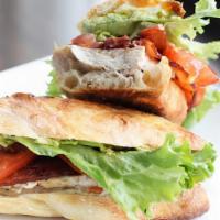 California Club · Piled high Cajun turkey layered with thick cut bacon, sliced avocado, lettuce, tomato with h...