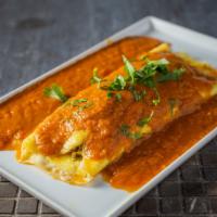Floating Omelette · Cheese stuffed omelette topped with tomato based gravy.