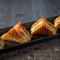 Paneer Masala Sandwich · Double layered grilled cheese sandwich with marinated paneer and veggies.