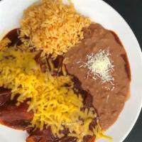 Enchiladas With Cheese Tex-Mex · 3 enchiladas stuffed with yellow cheese, covered in red chili ancho gravy sauce, yellow chee...