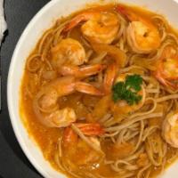 Camarona Pasta · Spaghetti with shrimp in tomato sauce with basil.