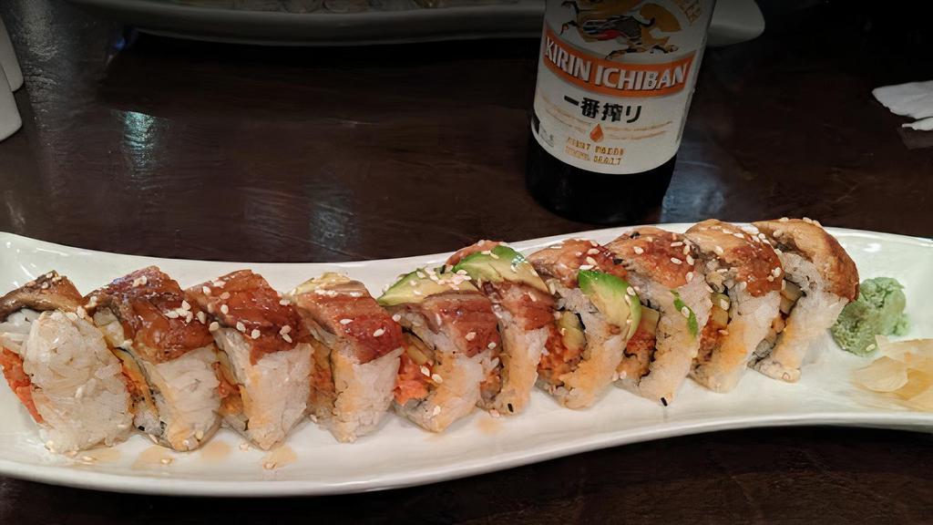 Red Dragon · Spicy tuna, cucumber, masago and baked eel on top.