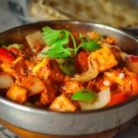 Kadhai · Hearty tomato curry with roasted cilantro. Spicy. Gluten free.