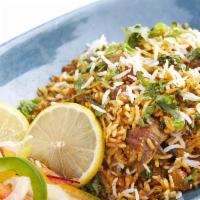 Lamb Biyarni · Basmati rice with slow cooked lamb and in-house special spices. Gluten free.