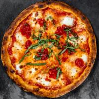 Marguerita Pizza · Tomato sauce, fresh Mozzarella, and basil.