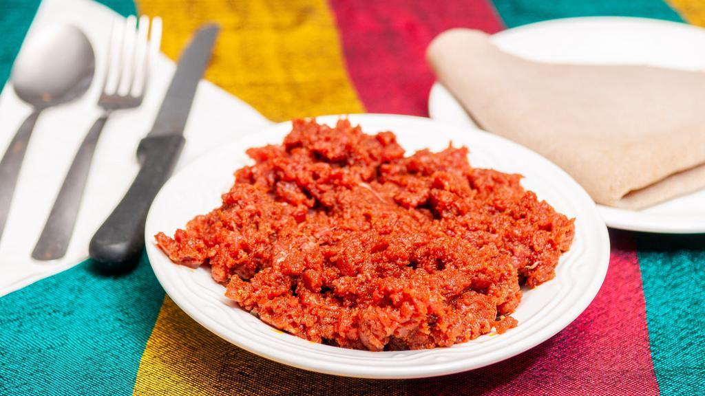 Kitfo · Ethiopian style steak tartar, * seasoned to a rich flavor with special blend of spices, spiced butter and mit'mit'a(a hot blend of dried ground chilies). Prepared traditionally uncooked or slightly seared.