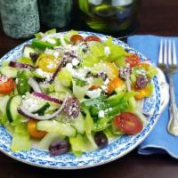 Greek Romaine Salad · Romaine lettuce with tomatoes, cucumbers, onions, peppers, Kalamata olives, vegan Feta, and ...