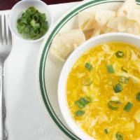 Egg Drop Soup · Soup that is made from beaten eggs and broth. served with fried noodles.