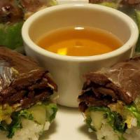Grilled Spring Rolls · Grilled, marinated meat fillings, served with dipping sauce.