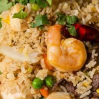 Fried Rice · Your choice of meat with onions, peas and carrots mixed with egg fried rice.