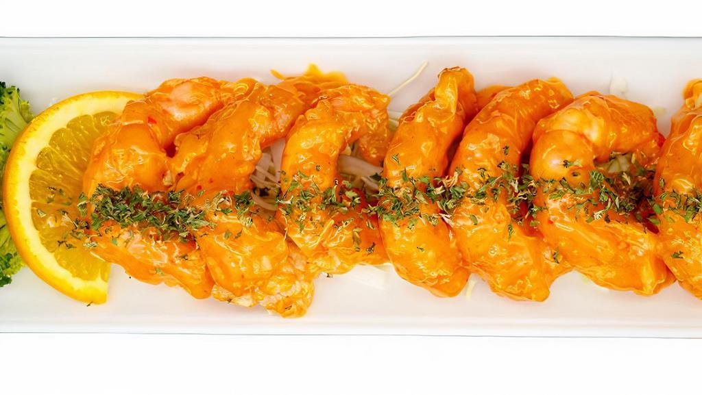 Boom Boom Shrimp · 7 pieces of shrimp fried to perfection then covered in a house spicy aioli. Slightly spicy. Sauce on the side for take outs.