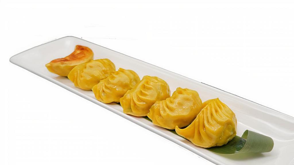 Chicken & Vegetable Dumpling · 6 yellow dumplings filled with chicken and vegetables. It is great for dumpling lovers that aren't into pork. You can choose either steamed or panfried!