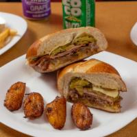 Cuban Sandwich · This is the only one with no lechuga o tomate. Served with pickles and mustard, pork, ham an...
