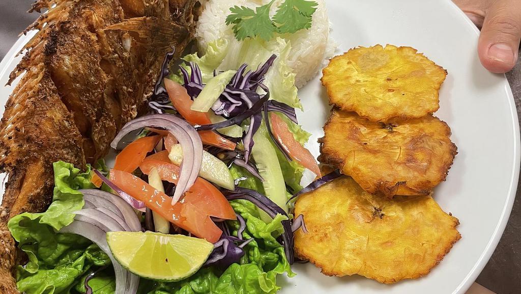 Huachinango Frito · Deep fried whole red snapper. Served with white rice, romaine salad and tostones.