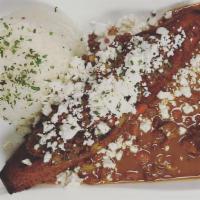 Canoa De Platano · Deep fried sweet plantain stuffed with picadillo topped with cheese, garnished with cilantro...