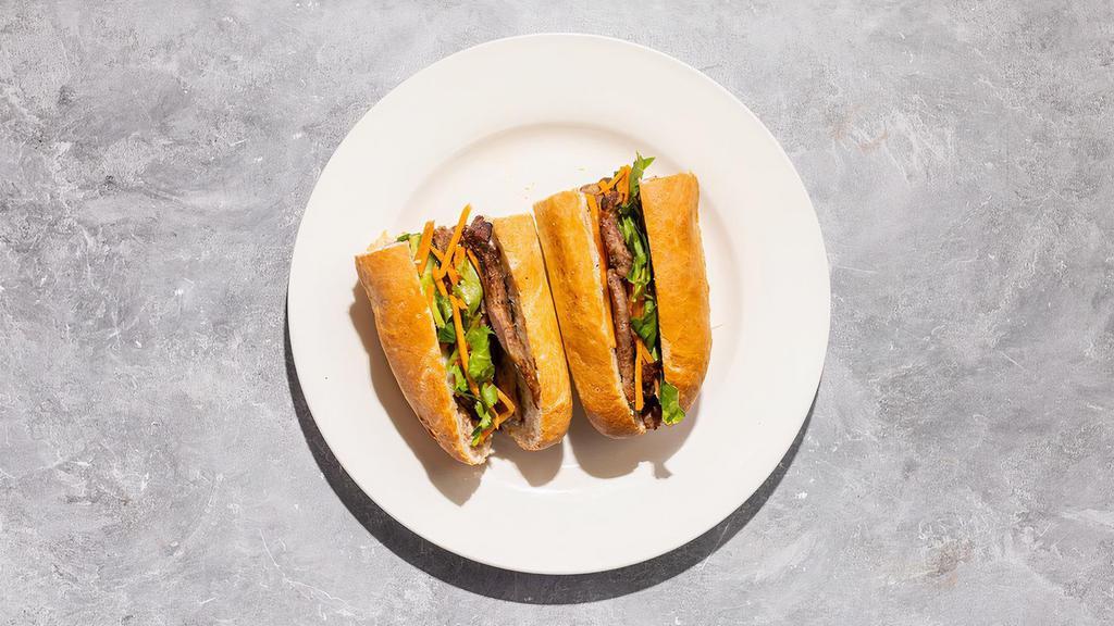 Meat Lover Banh Mi · By Banh Mi Viet. Char-grilled lemongrass marinated pork. Prepared with cilantro, cucumber, jalapeno, and pickled carrot. Contains gluten, nightshades, and eggs. We cannot make substitutions.