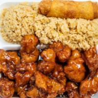 Orange Chicken · Served with rice and eggroll.