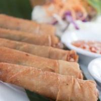 Shrimp Blanket (5) · Shrimp marinated in Thai seasonings, crabmeat, green onions, in a crispy wrap served with sw...
