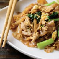 Pad See Eew · Asian broccoli, bok choy, egg, and Thai seasonings stir-fried 
with big flat noodles with yo...