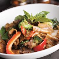 Pad Kee Mow · Minced chicken, tomatoes, carrots, onions, bell peppers, and fresh basil  stir-fried with bi...