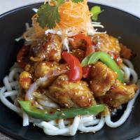 Udon Sesame Chicken · Lightly battered chicken in a sweet and tangy sesame sauce 
served with onions and bell pepp...