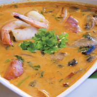 Tom Kha Soup · An exotic spicy soup with coconut milk, mushrooms, tomatoes, cilantro, lemongrass, galangal ...