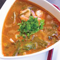 Tom Yum Soup · A tasty, spicy combination of herbs, mushrooms, tomatoes, cilantro,  lemongrass, galangal ro...