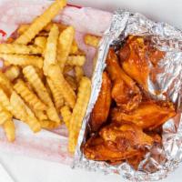 Wings (5Pcs) · Fried wings with flavor of your choice served with seasoned fries.