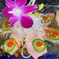 Yellowtail Crudo · Six pieces yellowtail topped with jalapeno, masago and scallion in ponzu and house sauce.