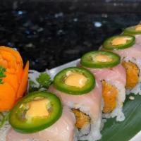 Ichiban Roll · Spicy Salmon, asparagus inside, yellowtail and sliced jalapeno on top with rice seasoning, s...