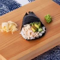 Blue Crab Hand Roll · Blue crab with sushi rice, wrapped in nori.