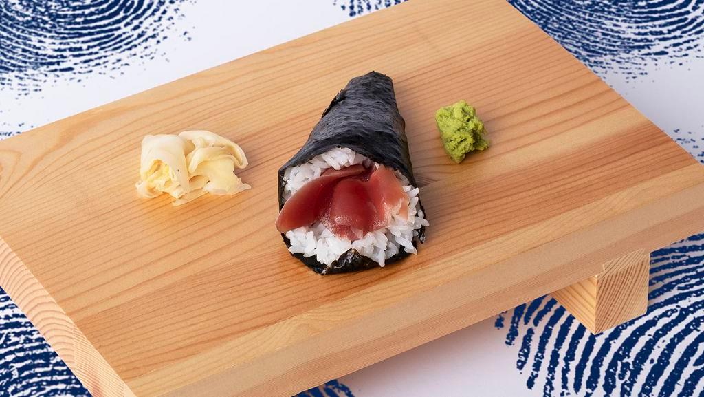 Tuna Hand Roll · Fresh tuna with sushi rice, wrapped in nori.