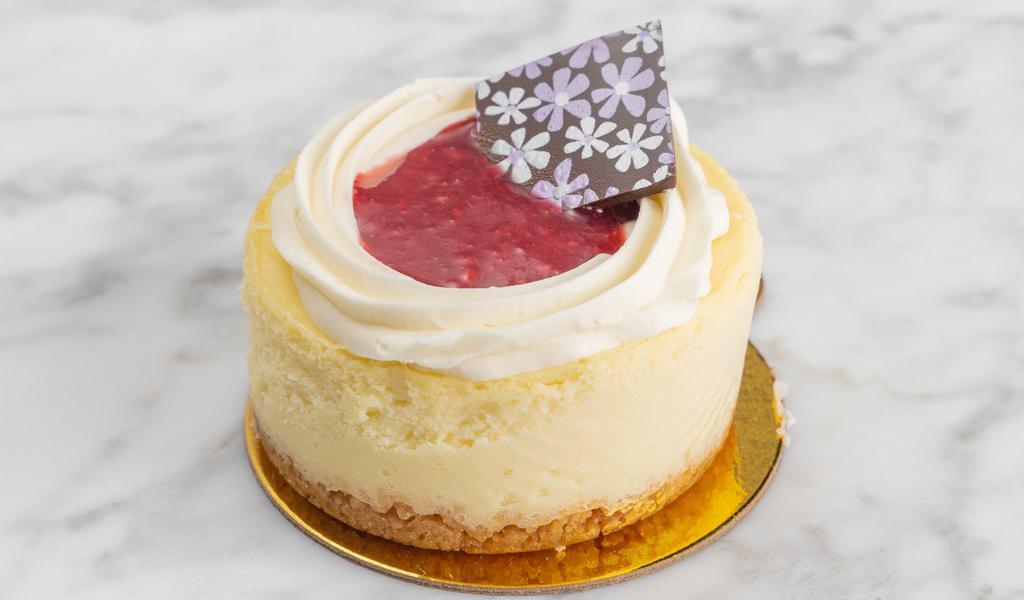 Vanilla Cheesecake · Creamy vanilla cheesecake topped with berry jam.