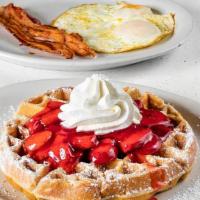Waffle Combo · Two eggs any style and two bacon strips or one sausage patty.