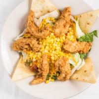 Chicken Tender Salad · Fresh lettuce, topped with golden fried chicken, cut corn, tomatoes, and cheese.