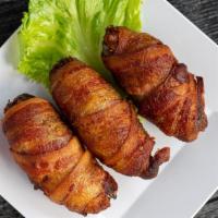 Bacon Wrapped Crab Stuffed Jalapenos · Pickled jalapeno halves stuffed with boudin and homemade crab meat, wrapped with bacon, deep...