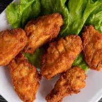 Buffalo Wings · Chicken wings breaded, deep fried and tossed in buffalo wing sauce.  Served with homemade ra...